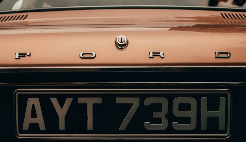 Photo by Matt Seymour orange and black car plate