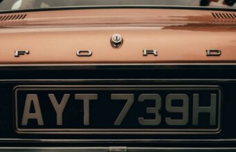 Who Pays When a Private Plate Transfer Goes Wrong on a Company Vehicle? orange and black car plate