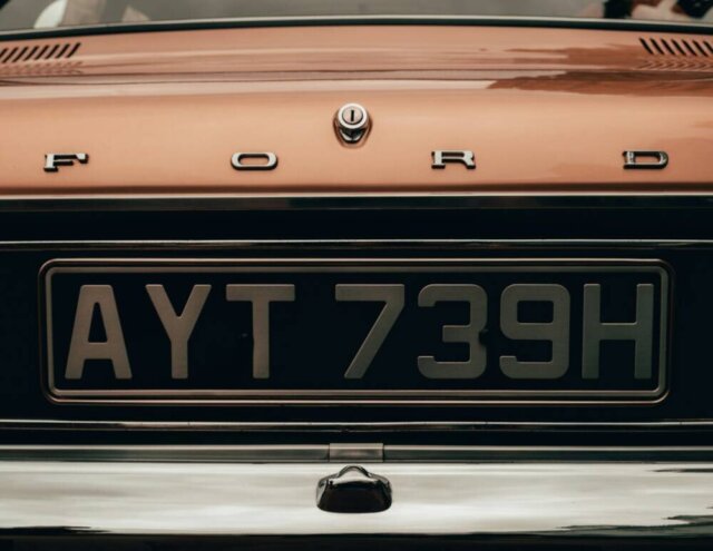 Who Pays When a Private Plate Transfer Goes Wrong on a Company Vehicle? orange and black car plate
